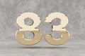 Gold 3d number 83. Glossy golden number on concrete background. 3d rendered digit