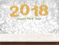 Gold 2018 3d rendering happy new year hanging over marble tabl