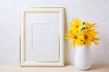 Gold decorated frame mockup with yellow rosinweed flowers Royalty Free Stock Photo