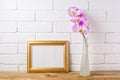 Gold decorated landscape frame mockup with pink orchid