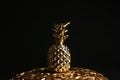 Gold decorative pineapple on plate