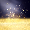 Gold defocused glitter lights, bokeh over black background Royalty Free Stock Photo