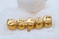 Gold dental crowns on sugar