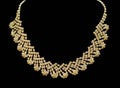 Gold and diamond necklaces isolated on black background. Royalty Free Stock Photo