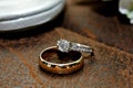 Gold and Diamond Wedding Ring on Leather Surface