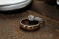Gold and Diamond Wedding Ring on Leather Surface