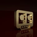 Gold DJ remote for playing and mixing music icon isolated on brown background. DJ mixer complete with vinyl player and