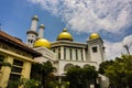 The gold dome of a mosque with cloudy sky as background photo taken Pekalongan Indonesia Royalty Free Stock Photo