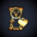 Gold Donate child toys icon isolated on black background. Charity kindness, volunteer social assistance. Vector