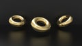 Gold donuts or rings 3d rendered object in a studio backdrop.