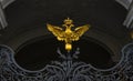 Gold, double-headed eagle on iron gates Royalty Free Stock Photo