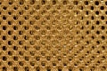 Gold double shiny braided metal mesh with a black background