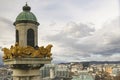 Gold eagles on the tower of Karlskirche and Panoramic view of Vienna from the St. Charles Church in Vienna, Austria