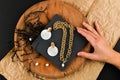 Gold earrings with a necklace. Close-up. Laid out on a wooden stand. View from above. The concept of jewelry and jewelry. Gifts