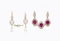 Gold earrings and rings with diamonds and rubies Royalty Free Stock Photo