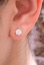 Gold earrings stud with diamonds macro shot Royalty Free Stock Photo