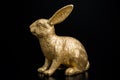 gold Easter bunny rabbit on black background Royalty Free Stock Photo