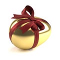 Gold easter egg with red ribbon