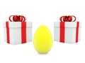Gold egg between gift boxes Royalty Free Stock Photo