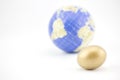 Gold egg with globe reflect modern world of global investments