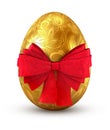 Gold egg with red bow. Royalty Free Stock Photo