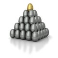 Gold egg topped pyramid of lead eggs