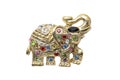 Gold elephant brooch isolated on white