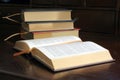 Gold Embossed Books on Wooden Desktop