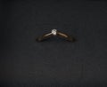 Gold engagement ring with a diamond closeup in a box. Royalty Free Stock Photo