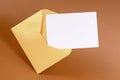 Gold brown manila envelope with blank message card or letter, copy space Royalty Free Stock Photo