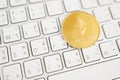 Gold Ethereum coin on white keyboard with laptop. Cryptocurrency Stock Market Concept Royalty Free Stock Photo