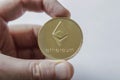 A Large Etherium Token in hand Royalty Free Stock Photo