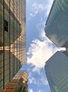 Gold exterior glass of office building, blue sky and white cloud Royalty Free Stock Photo