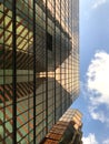 Gold exterior glass of office building, blue sky and white cloud Royalty Free Stock Photo