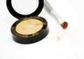Gold eyeshadow and brush Royalty Free Stock Photo