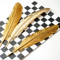 Gold feathers on checkered background on white background Royalty Free Stock Photo