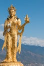 Female religious statue at Great Buddha Dordenma statue, Thimphu, Bhutan, with snow capped mountains in background