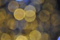 Gold festive glitter background with defocused lights.Abstract gold circular bokeh background of christmas light gold Royalty Free Stock Photo