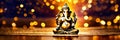 gold figurine of Ganesha. Selective focus.