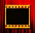 Gold film on the red curtain Royalty Free Stock Photo
