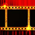 Gold film on the red curtain Royalty Free Stock Photo