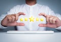 Gold five stars point, best excellent rating satisfaction showing by frame making by man`s hands. Royalty Free Stock Photo