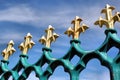 Gold fleur de lis on blue iron railings Royalty Free Stock Photo