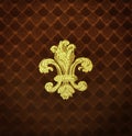 Gold Fleur-de-lis embroidered on a rust color fabric