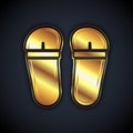 Gold Flip flops icon isolated on black background. Beach slippers sign. Vector
