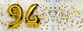Gold foil balloon number, digit ninety-four. Birthday greeting card with inscription 94. Anniversary celebration. Banner