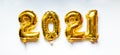 Gold foil balloons numeral 2021 on white background. Happy New year 2021 celebration