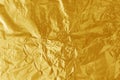 Gold foil leaf shiny texture, abstract yellow wrapping paper for background Royalty Free Stock Photo