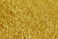 Gold foil leaf shiny texture, abstract yellow wrapping paper for background and design art work Royalty Free Stock Photo