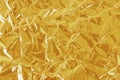 Gold foil leaf shiny texture, abstract yellow wrapping paper for background and design art work Royalty Free Stock Photo